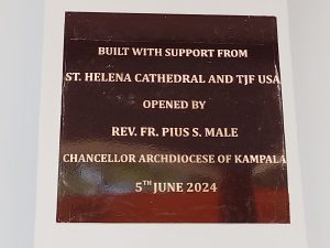 dedication plaque on the new dorm